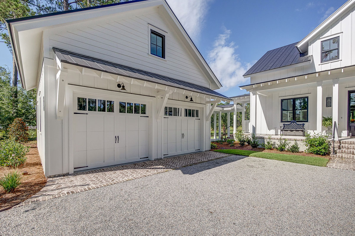 Detached garage with carriage-style doors connected to main house by a breezeway at 210 Davies Road Detached garage with carriage-style doors connected to main house by a breezeway at 210 Davies Road